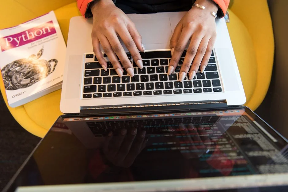 A contemporary workspace showcasing a laptop, tablet, and smartphones, ideal for tech and freelance use.